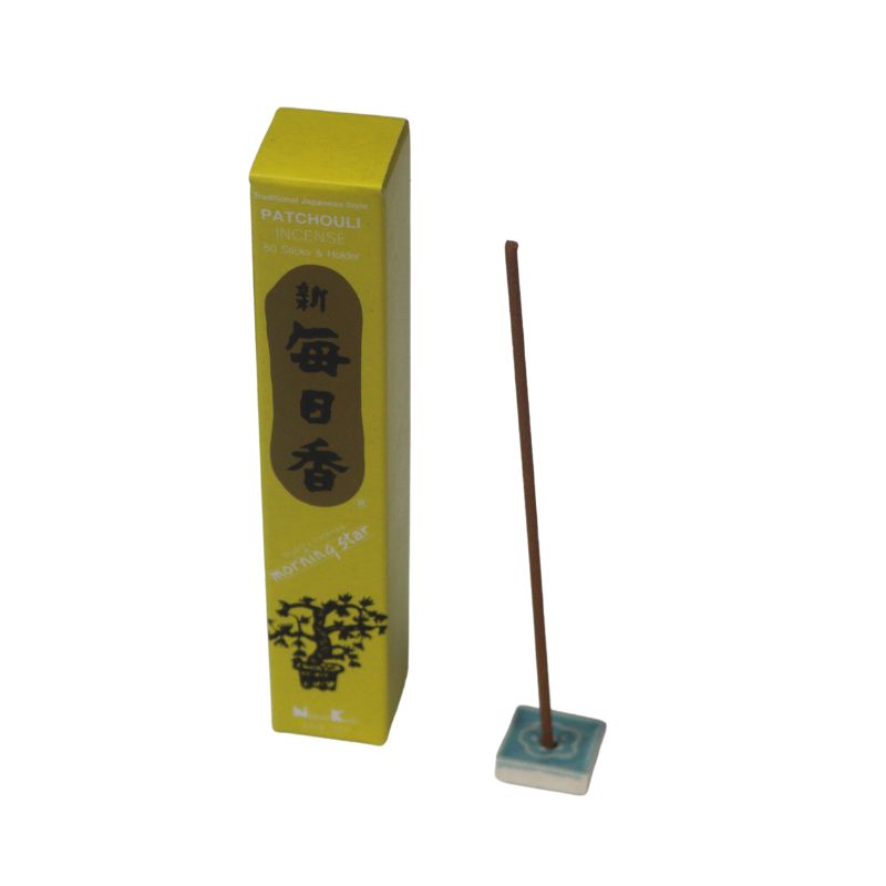 rectangle box of japanese morning star "Patchouli" incense sticks next to a tile incense holder