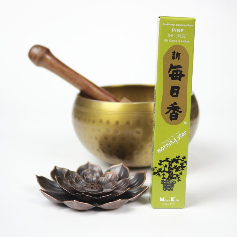 rectangle box of japanese morning star "Pine" incense sticks next to a lotus incense holder and brass singing bowl