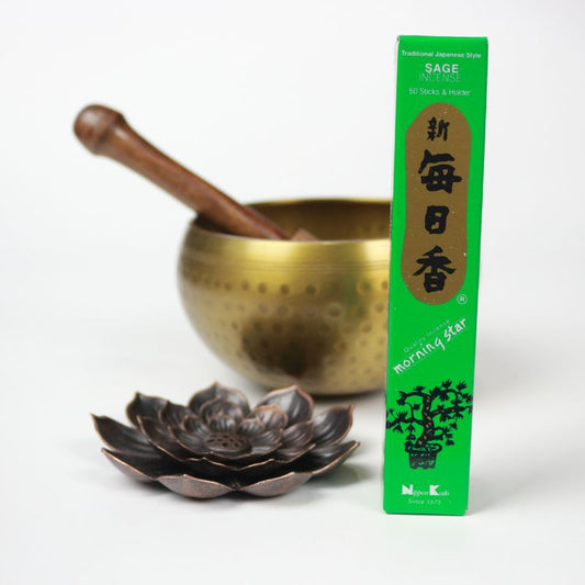 rectangle box of japanese morning star "Sage" incense sticks next to a lotus incense holder and brass singing bowl