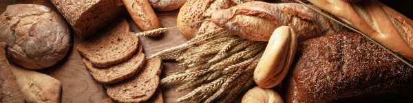 bread and wheat on table