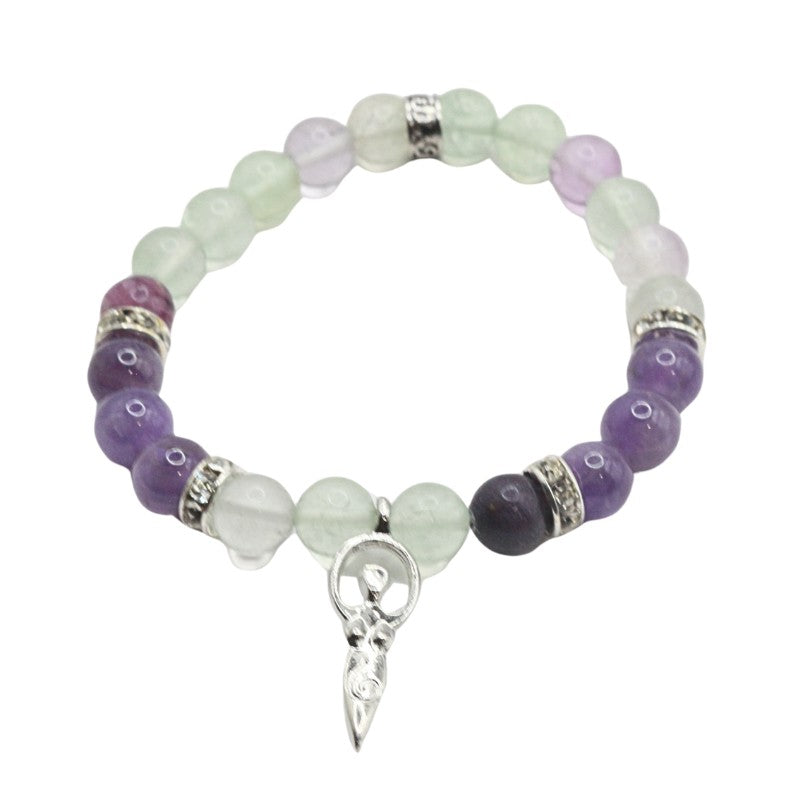 Beaded bracelet with purple and green beads and a silver charm on a white background