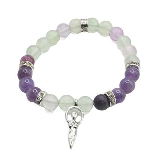 Beaded bracelet with purple and green beads and a silver charm on a white background