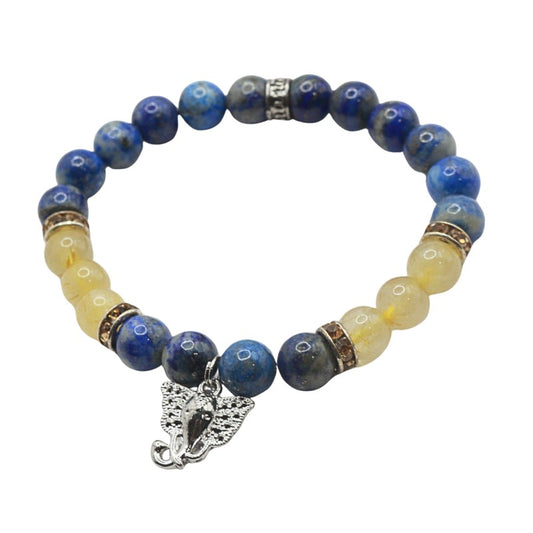 Bracelet with blue and yellow beads and a silver charm on a white background