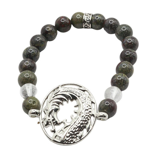 Bracelet with dark beads and a silver circular pendant on a white background