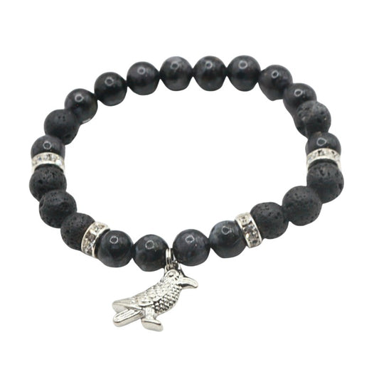 Black beaded crystal bracelet with a silver charm on a white background