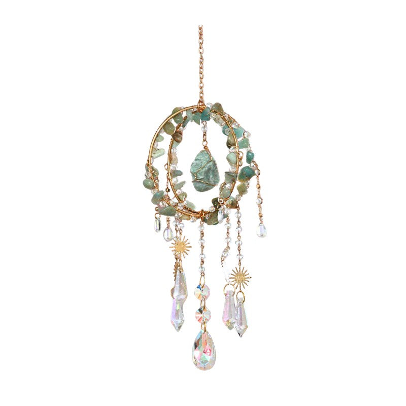 Decorative hanging ornament with stones and crystals on a white background