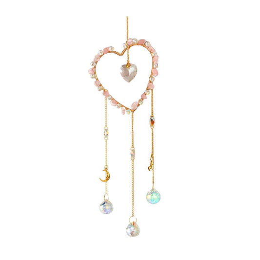 Heart-shaped suncatcher with beads and crystals on a white background