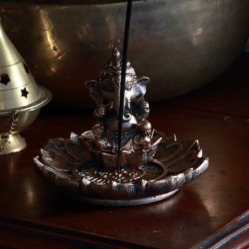 Ganesh incense holder on wooden table