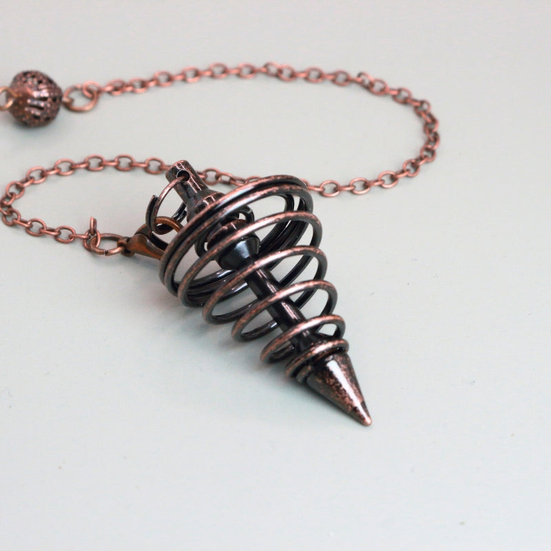 antique copper spiral pendulum 