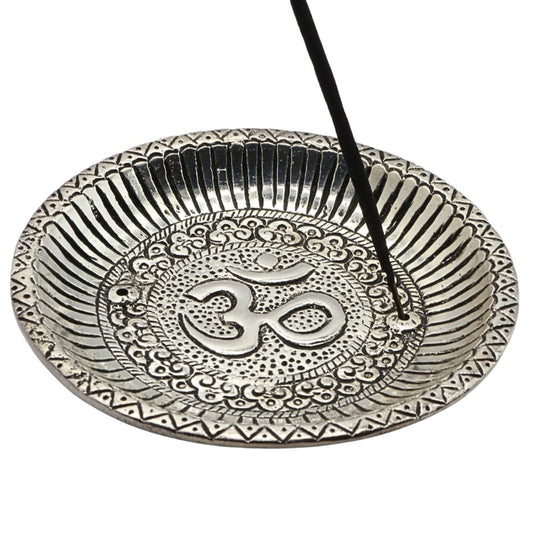 aluminium incense burner with om symbol holding a stick of incense