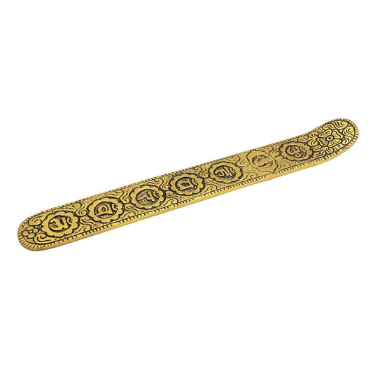 gold coloured aluminium incense burner with chakra symbols etched into top