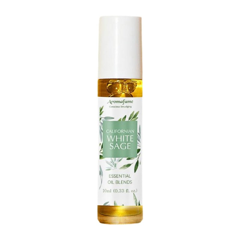 glass bottle containing oil with a white and green floral  label