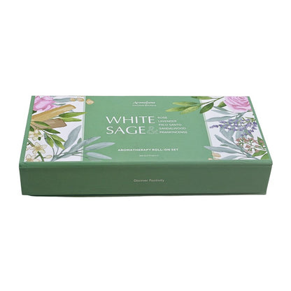 white and green packaging with "White Sage Aromatherapy Roll On Set" written on top