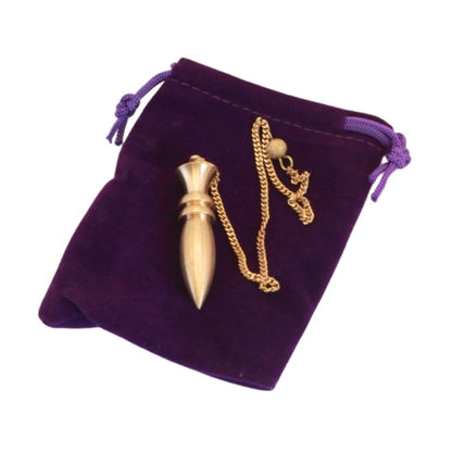 Brass pendulum on purple velvet pouch