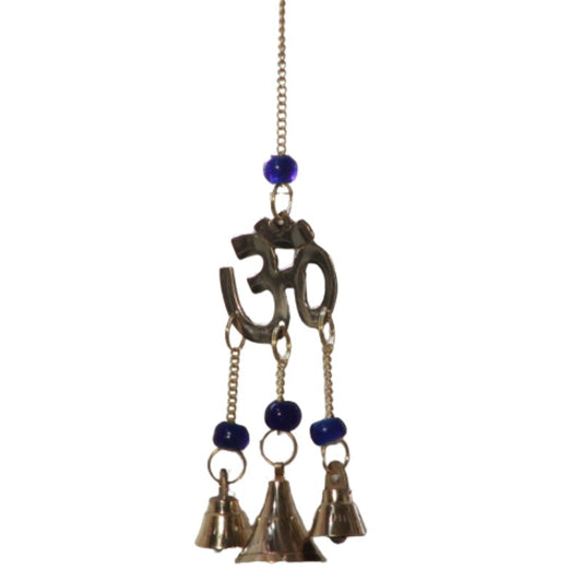 3 brass bells hanging from  chains suspended from a brass aum symbol