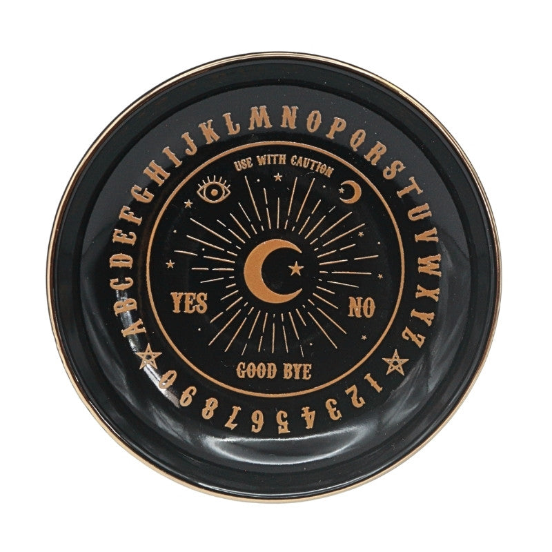 black ceramic dish with letters and numbers on it