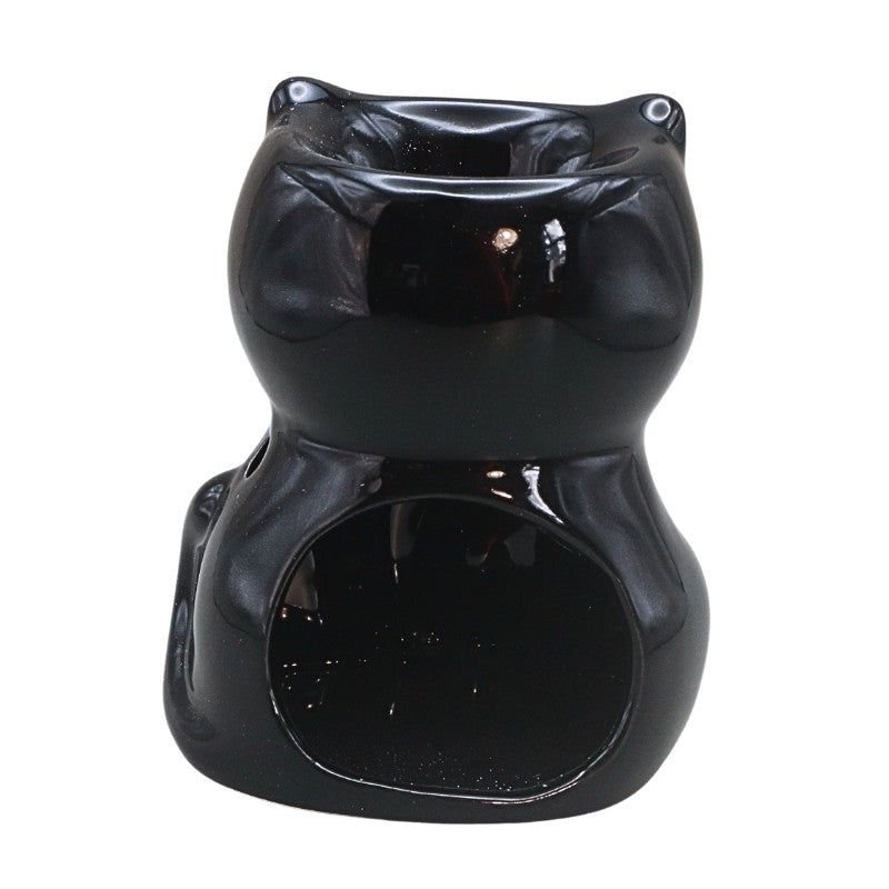 black cat shaped oil burner on a white background