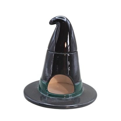 black ceramic witch hat  oil burner on white background