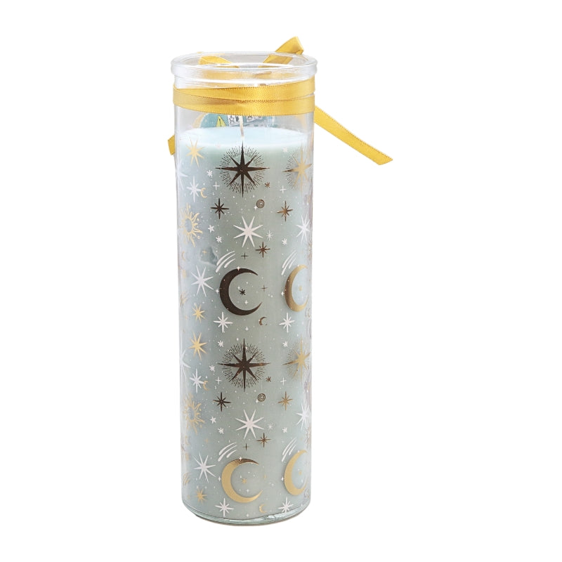 A tall glass prayer candle with a pale blue wax body decorated with gold and white celestial patterns of stars and crescent moons, sealed with a gold ribbon.