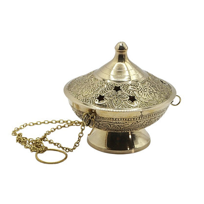 Decorative brass incense burner with intricate designs on a white background