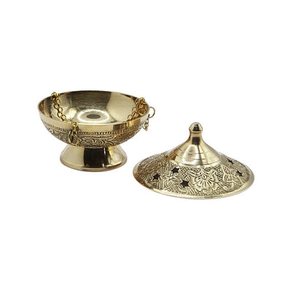 Two gold metal objects with intricate designs on a white background