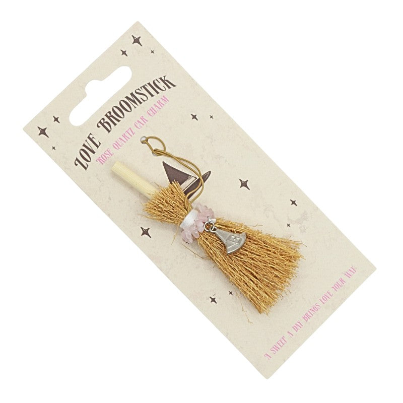 tiny broomstick car charm on card backing