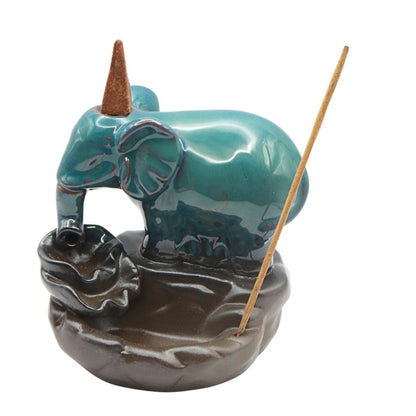 Ceramic elephant incense burner with backflow feature on a white background