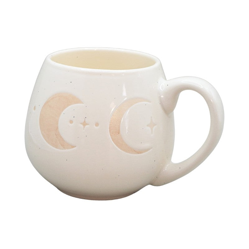 cream mug with crescent moon images on a white background