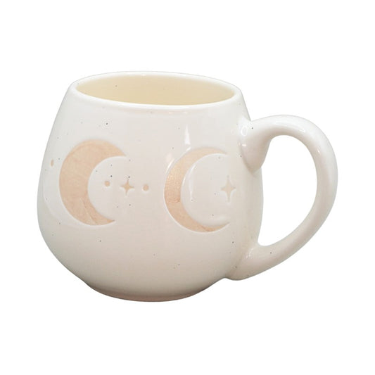 cream mug with crescent moon images on a white background