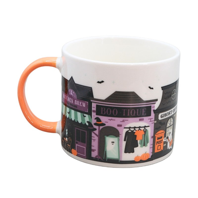  mug with spooky house designs on a white background

