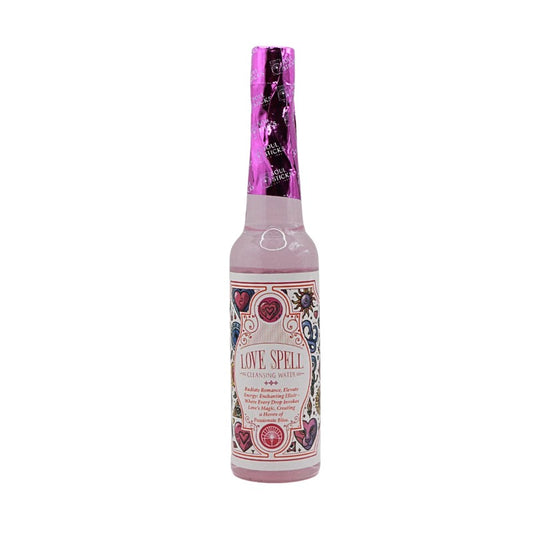 Bottle of 'Love Spell' with decorative label on a white background