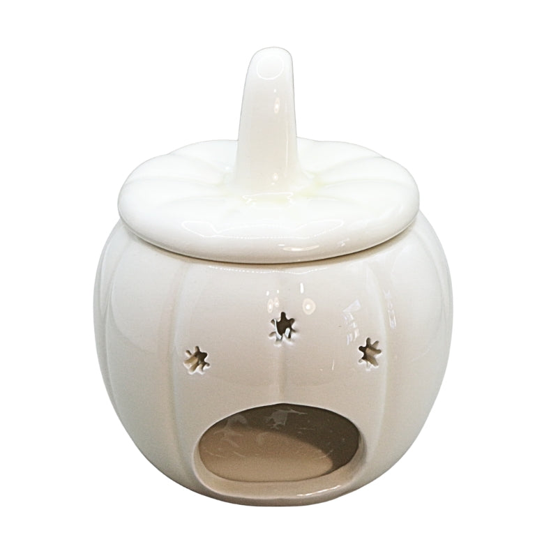ceramic pumpkin with a cut out in the front 