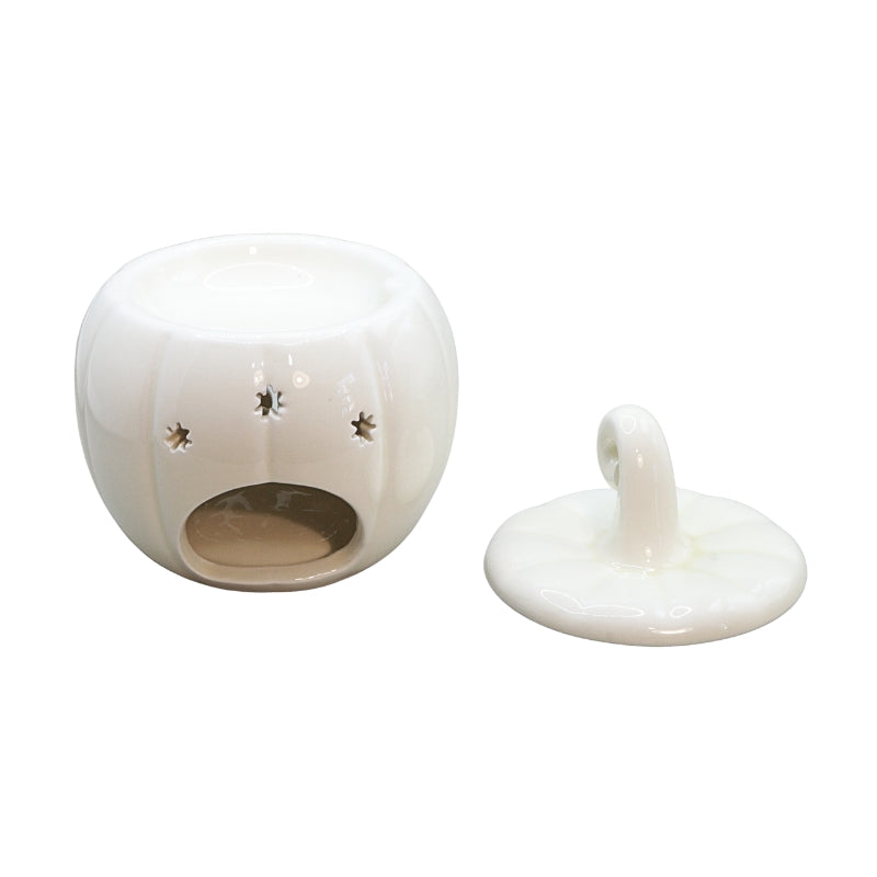 ceramic oil burner showing the burner base and lid next to each other on a white background