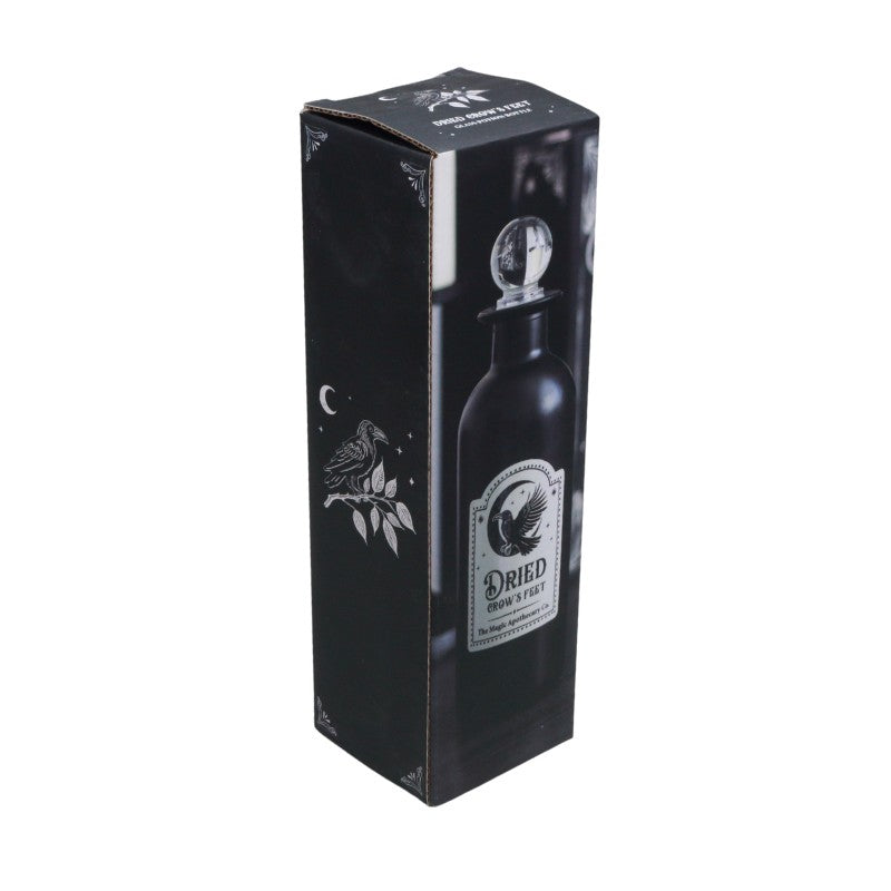 Black packaging box with a bottle design featuring a label on a white background