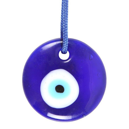 Flat glass bead blue with a white and blue centre to resemble an eye. Hanging from a blue cord