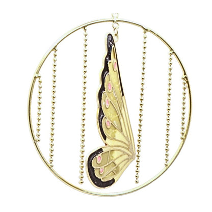 Gold circular hoop ornament with hanging bead chains and a central butterfly wing design in gold, black, and pink, shown on a white background.