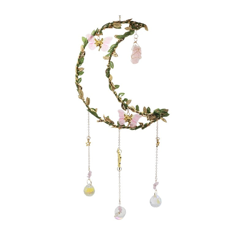 Decorative sun catcher with floral and butterfly elements on a white background