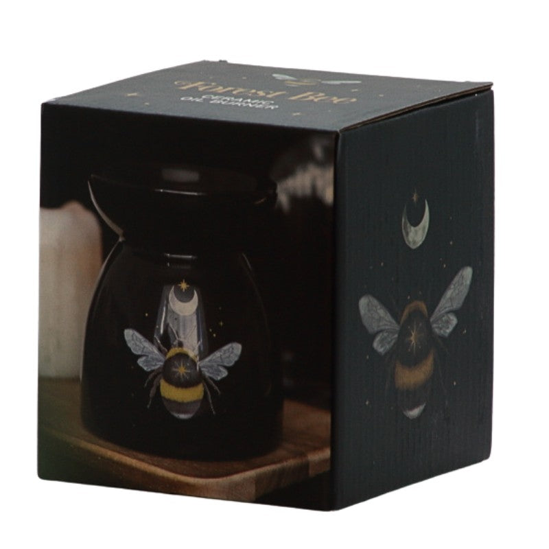 box showing Black oil burner with a yellow and black bee and crescent moon and stars printed on it