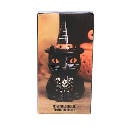 packaging box showing a black and orange cat oil burner with folk art floral design, on a white background