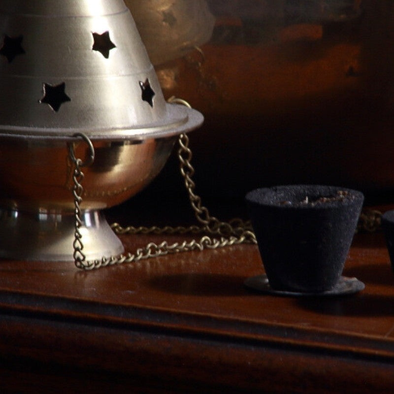 Goloka Smudge Cup next to brass censer/thurible