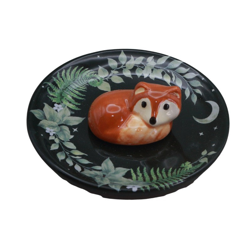 Decorative plate with a fox design on a white background