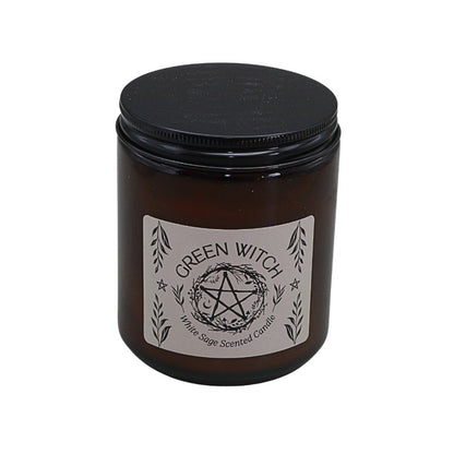 Brown candle jar with black lid and 'Green Witch' label on a white background