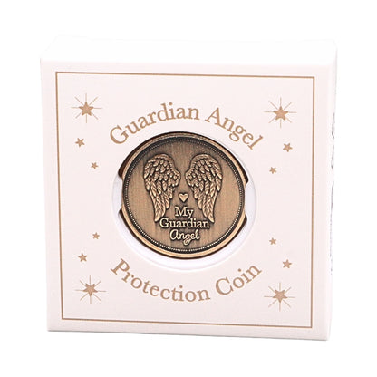 A round bronze-colored guardian angel protection coin displayed in a circular cutout on a cream-colored square box. The box features gold-toned text reading 'Guardian Angel' and 'Protection Coin' with decorative starburst designs.