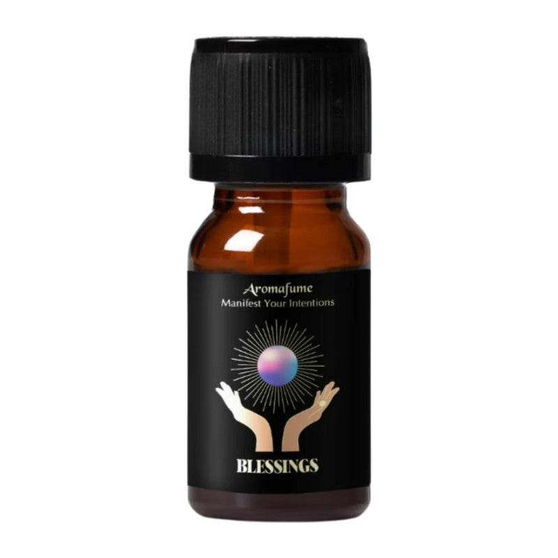 A small amber glass bottle with a black ribbed cap and a black label. The label features the brand name 'Aromafume' and the product name 'Blessings' in gold text, with a graphic of two hands holding a glowing purple orb.