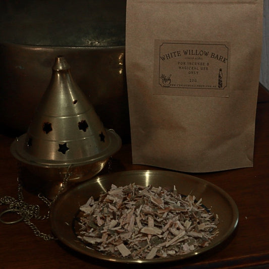 bag of dried willow bark next to censer and gold plate with dried willow bark