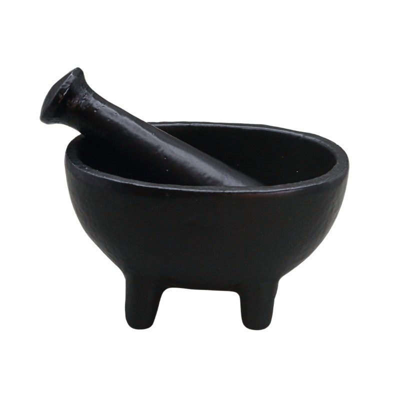 A small black wrought iron mortar and pestle set, photographed on a clean white background.