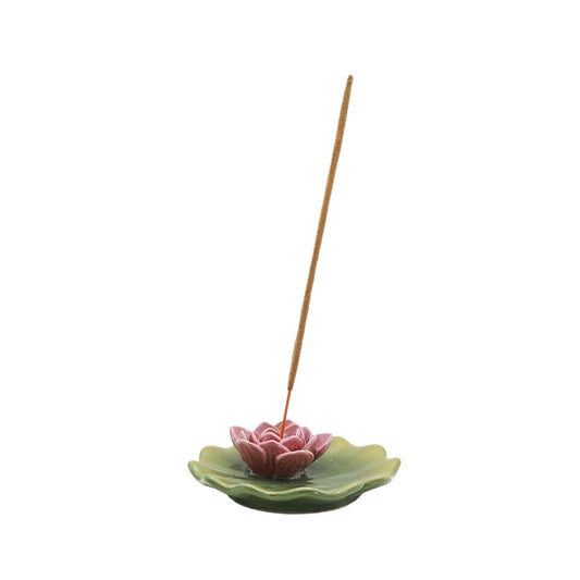 Incense burner shaped like a pink lily 
on a white background