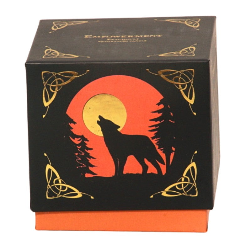 candle gift box-black with orange and gold- featuring a wolf on front with the word "empowerment" written in gold on top.