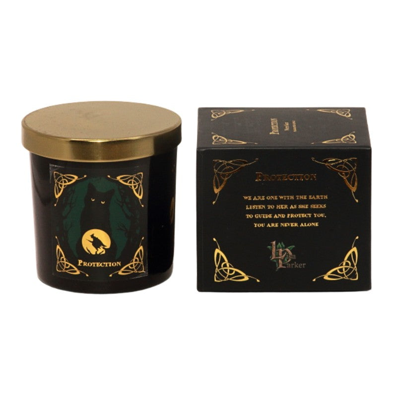 Glass candle with gold lid-green and gold sticker on front of a black cat and witch flying on a broomstick- on front with the word "protection" is written in gold. Next to gift box