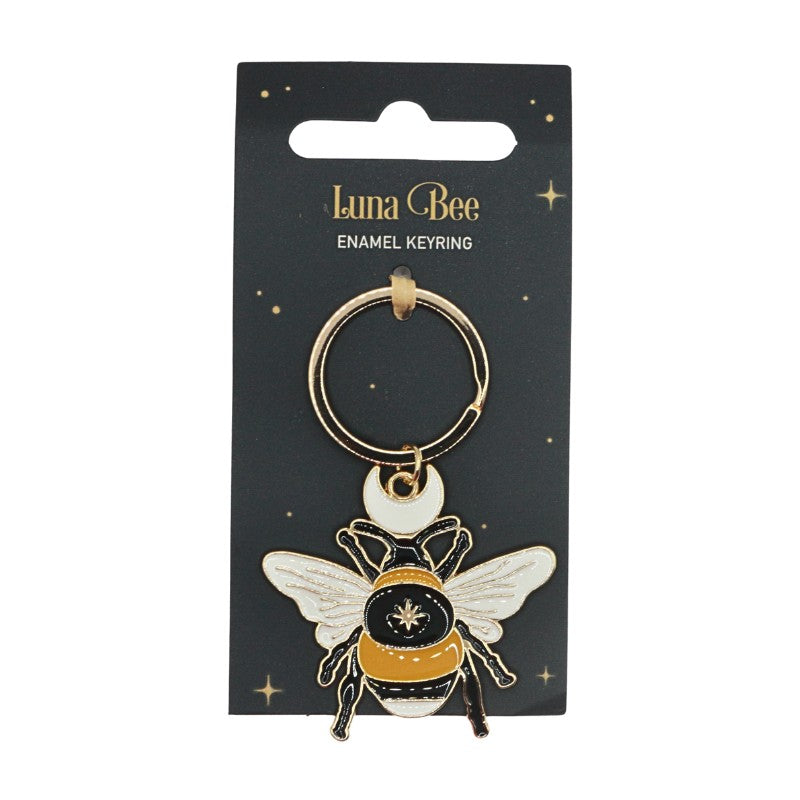 Luna Bee enamel keyring on a black card with gold accents